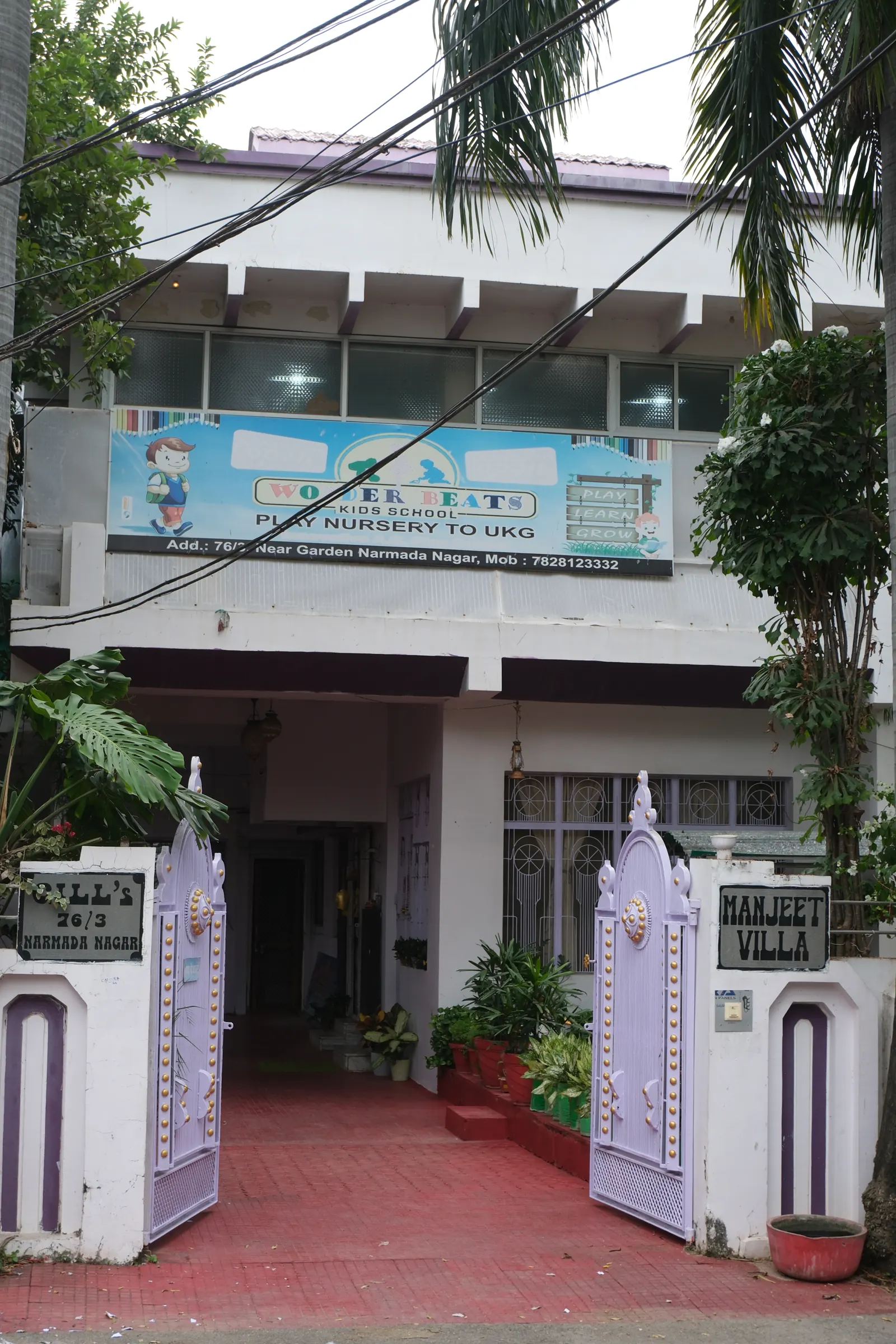 The gated entrance of Wonder Beats Kids School at Manjeet Villa